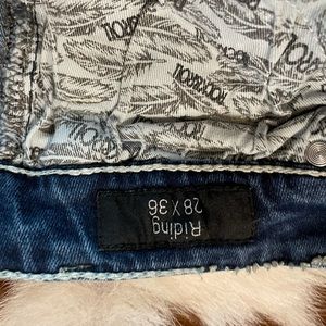 Rock and roll cowgirl riding jeans